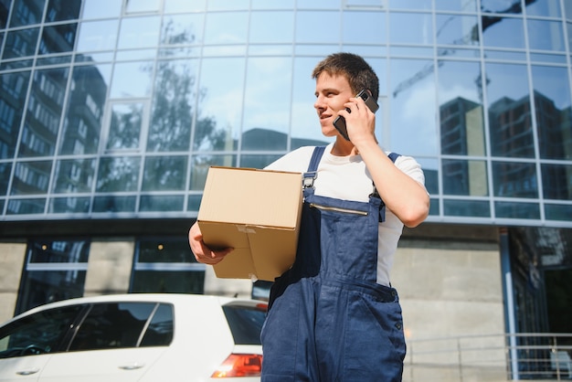 man carrying package from delivery car courier service concept 255667 14723